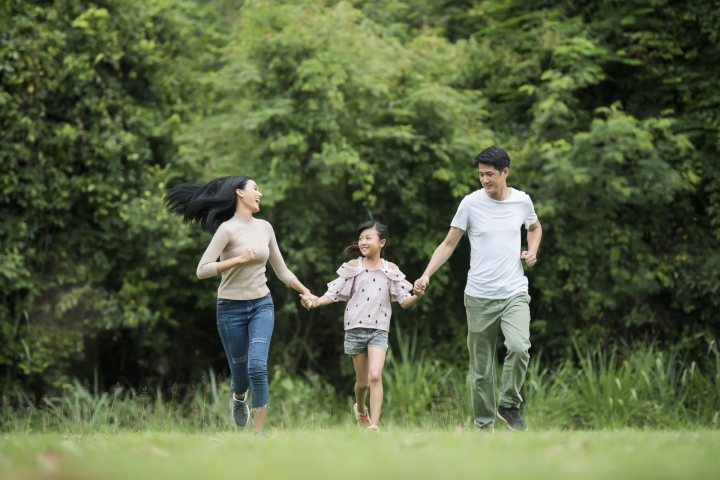/media/happy-family-is-having-fun-mother-father-daughter-are-running-park.jpg